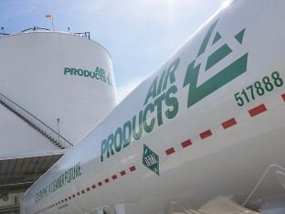 Air Products tanker in front of industrial gas storage tank