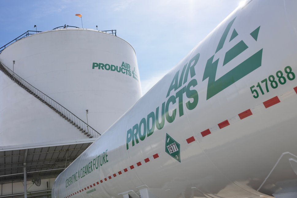 Air Products tanker in front of industrial gas storage tank