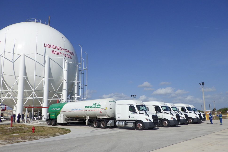 Air Products' hydrogen trucks in front of liquid hydrogen sphere at NASA's Kennedy Space Center